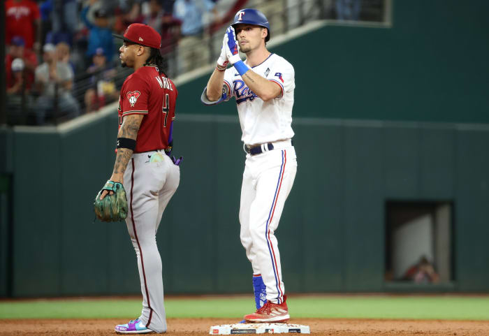 Oct 27, 2023; Arlington, TX, USA; Texas Rangers center fielder Evan Carter (32) reacts after a double during the third inning in game one of the 2023 World Series against the Arizona Diamondbacks at Globe Life Field. Mandatory Credit: Kevin Jairaj-USA TODAY Sports
